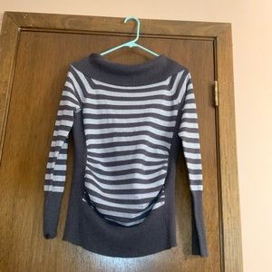 A large cute gray and silver sweater it was given to me and worn once !